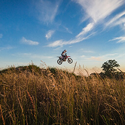 supermoto bike jumping endure field sky high sport motorbike Poland travel UGC content